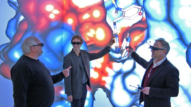 Prof. Dr. M. Rädle (M2edTech), Prof. Dr. R. Rudolf (M2OGA), Prof. Dr. C. Hopf (spokesperson of M2Aind) in the CAVE at the Competence Center Virtual Engineering Rhine-Neckar, Mannheim University of Applied Sciences.